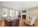 Bright living room with hardwood floors, a fireplace, and access to the outdoors at 56 Mist Wood Ct, Pittsboro, NC 27312
