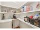 Spacious pantry features lots of shelf space, storage containers, and hardwood flooring at 56 Mist Wood Ct, Pittsboro, NC 27312