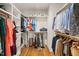 Organized walk-in closet with custom shelving and ample storage for clothes and accessories at 56 Mist Wood Ct, Pittsboro, NC 27312