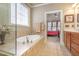 Relaxing bathroom boasts a soaking tub and natural light at 5624 Bennettwood Ct, Raleigh, NC 27612