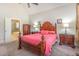 Bedroom leading into ensuite bath features decorative furnishing at 5624 Bennettwood Ct, Raleigh, NC 27612