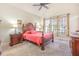 Spacious bedroom boasts plush carpet, a ceiling fan, and natural light at 5624 Bennettwood Ct, Raleigh, NC 27612