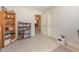 Bright bedroom showing shelving and access to the other rooms in the home at 5624 Bennettwood Ct, Raleigh, NC 27612