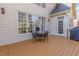 Deck featuring an outdoor dining set, grill and scenic view of the backyard, perfect for entertaining at 5624 Bennettwood Ct, Raleigh, NC 27612