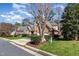 Traditional brick home with well-maintained landscaping and a two-car garage at 5624 Bennettwood Ct, Raleigh, NC 27612
