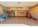 Well-organized garage showcasing epoxy flooring, storage cabinets, utility equipment, and a clean, functional layout at 5624 Bennettwood Ct, Raleigh, NC 27612