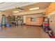 Spacious garage featuring an epoxy floor, custom cabinets, shelving, and ample room for vehicles or storage at 5624 Bennettwood Ct, Raleigh, NC 27612