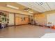 View of garage with epoxy floor, custom cabinetry, and convenient access to the home's backyard at 5624 Bennettwood Ct, Raleigh, NC 27612