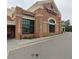 Exterior view of Harris Teeter Neighborhood Food & Pharmacy, a brick commercial building with ample parking at 5624 Bennettwood Ct, Raleigh, NC 27612