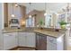 Kitchen with granite countertops, stainless steel appliances, and an open concept design to living area at 5624 Bennettwood Ct, Raleigh, NC 27612