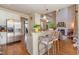 Kitchen featuring granite countertops, stainless steel appliances, and bar seating open to the living area at 5624 Bennettwood Ct, Raleigh, NC 27612
