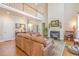 Open living room with soaring ceilings, a fireplace, and a view of the upper level at 5624 Bennettwood Ct, Raleigh, NC 27612