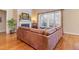 Comfortable living room featuring a fireplace and a large window overlooking the backyard at 5624 Bennettwood Ct, Raleigh, NC 27612