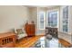 Elegant living area featuring a bay window, hardwood floors, and stylish furniture at 5624 Bennettwood Ct, Raleigh, NC 27612