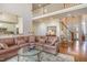 Open-concept living space featuring hardwood floors and seamless flow to kitchen and dining area at 5624 Bennettwood Ct, Raleigh, NC 27612