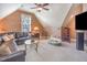 This comfortable living room has a brown leather sofa and lots of open floor space at 5624 Bennettwood Ct, Raleigh, NC 27612
