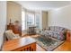 Cozy living room with large windows, plush seating, and a decorative rug at 5624 Bennettwood Ct, Raleigh, NC 27612
