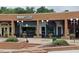 Relish Craft Kitchen & Bourbon Bar has an inviting entrance and outdoor seating in a brick building at 5624 Bennettwood Ct, Raleigh, NC 27612