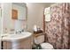 Standard bathroom featuring a vanity, toilet, and floral shower curtain at 5630 Jones Sausage Rd, Garner, NC 27529
