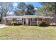 Charming brick home with well-maintained lawn and inviting front porch at 5630 Jones Sausage Rd, Garner, NC 27529