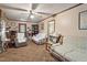 Comfortable living room with ceiling fan and neutral color scheme at 5630 Jones Sausage Rd, Garner, NC 27529