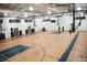 Spacious indoor basketball court with hardwood floors, multiple hoops, and ample lighting for recreational activities at 603 Mountain Pine Dr, Cary, NC 27519