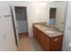 Bathroom featuring double sink vanity with granite countertop, complemented by tile flooring and ample lighting at 603 Mountain Pine Dr, Cary, NC 27519