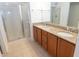 Bathroom with double sinks, granite countertop, and glass shower doors at 603 Mountain Pine Dr, Cary, NC 27519