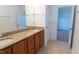 Bathroom with double sinks, granite countertop, tile flooring and white trim at 603 Mountain Pine Dr, Cary, NC 27519