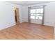 Bright bedroom with window, ceiling fan, and bathroom access at 603 Mountain Pine Dr, Cary, NC 27519