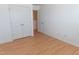 Bedroom with double closet, light-colored walls and wood-look flooring at 603 Mountain Pine Dr, Cary, NC 27519