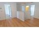 Bright hallway with wood-look flooring leads to multiple rooms at 603 Mountain Pine Dr, Cary, NC 27519