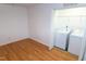 Laundry room with washer and dryer in closet with wood-look flooring at 603 Mountain Pine Dr, Cary, NC 27519