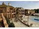 Resort-style community pool area with tables and seating, perfect for relaxing and socializing at 603 Mountain Pine Dr, Cary, NC 27519