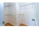 Spacious walk-in closet with wire shelving and wood-look flooring at 603 Mountain Pine Dr, Cary, NC 27519