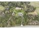 Home on a lot with lush green trees, long driveway and surrounded by nature at 610 Flemingtown Rd, Henderson, NC 27537