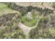 Aerial view of a home in the country with large yard and mature landscaping at 610 Flemingtown Rd, Henderson, NC 27537