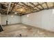 Spacious unfinished basement featuring concrete floor, insulation, and clean, white-painted walls at 610 Flemingtown Rd, Henderson, NC 27537