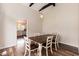 Dining area includes a wooden table with white chairs and hardwood floors at 610 Flemingtown Rd, Henderson, NC 27537