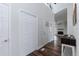Bright entryway with high ceiling, stylish doors, and wood floors at 610 Flemingtown Rd, Henderson, NC 27537