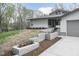 Charming front yard featuring new landscaping, concrete walkway, and modern exterior at 610 Flemingtown Rd, Henderson, NC 27537