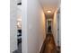 Hallway with hardwood floors leads to various rooms in the home at 610 Flemingtown Rd, Henderson, NC 27537