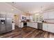 Bright kitchen featuring stainless steel appliances, white cabinets, and wood countertops at 610 Flemingtown Rd, Henderson, NC 27537