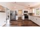 The modern kitchen includes stainless steel appliances and white cabinets with butcher block countertops at 610 Flemingtown Rd, Henderson, NC 27537