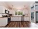 Modern kitchen featuring white cabinets, butcher block counters, and stainless steel appliances at 610 Flemingtown Rd, Henderson, NC 27537