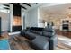 Cozy living room featuring a stylish couch, fireplace, and views to the kitchen area at 610 Flemingtown Rd, Henderson, NC 27537