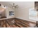 Bright and open living room with hardwood floors and a large window offering natural light at 610 Flemingtown Rd, Henderson, NC 27537