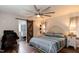Spacious bedroom with a decorative barn door leading to an ensuite bath at 610 Flemingtown Rd, Henderson, NC 27537