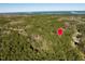 Aerial view of wooded lot with large trees and surrounding landscape at 63 Pennington Cir, Chapel Hill, NC 27517
