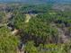 Expansive aerial view of the property, showcasing the lush landscape and secluded location at 63 Pennington Cir, Chapel Hill, NC 27517